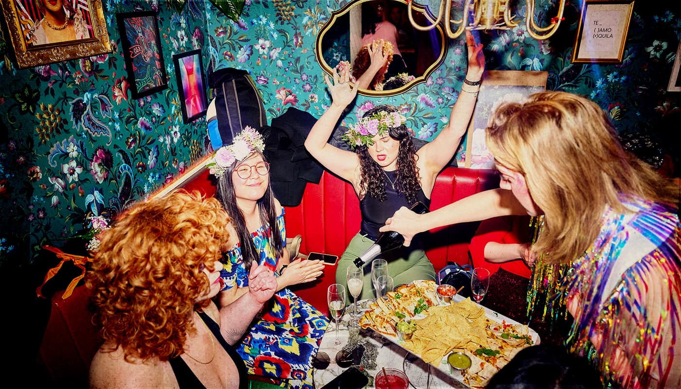 Women enjoying food and drink at Barrio Bars