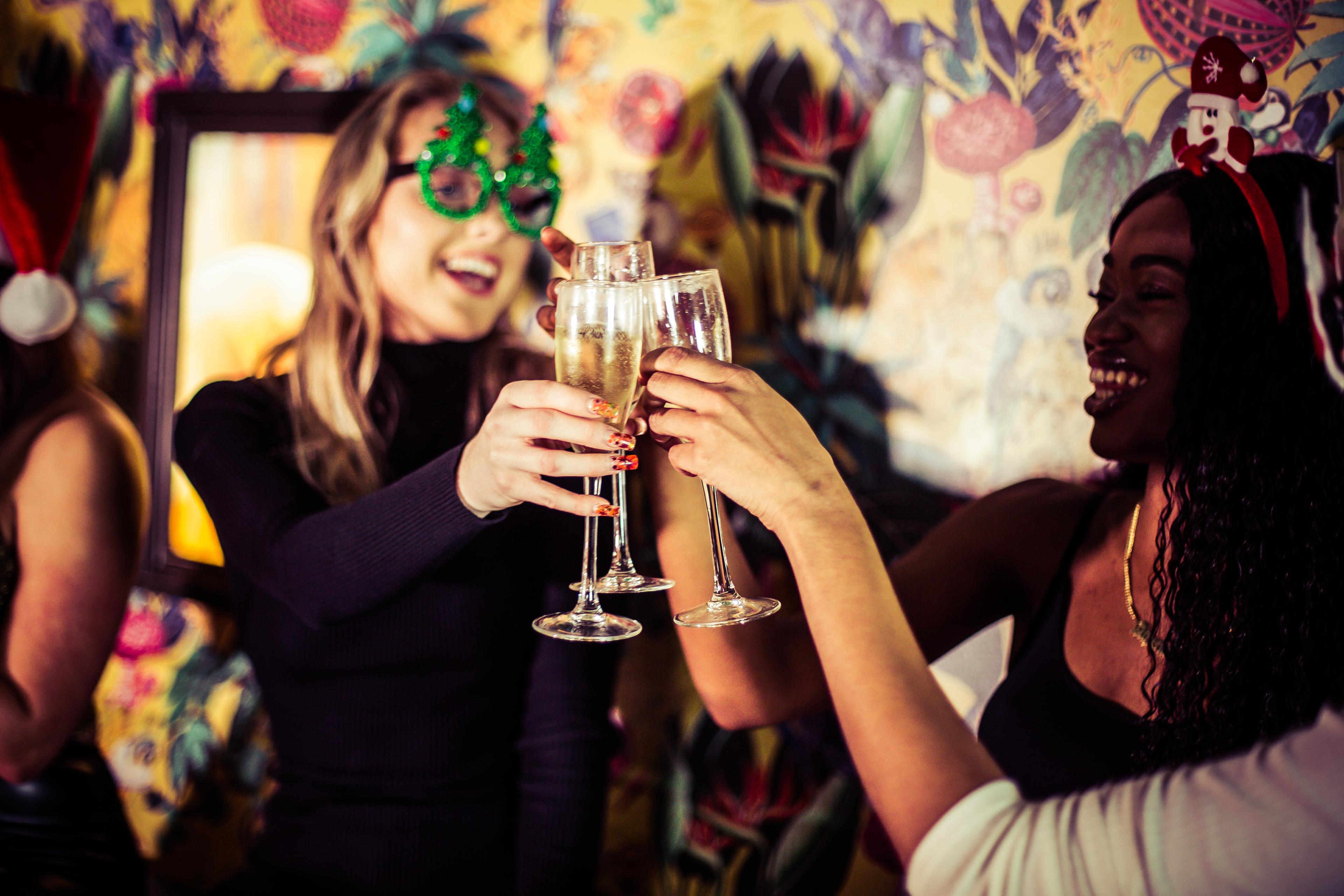 Women Celebrating Christmas While Drinking Prosecco at Barrio Bars